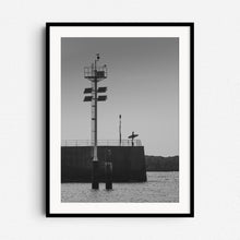 Load image into Gallery viewer, Black and white surfer silhouette in Scheveningen, framed in black wood for a striking and classic surf art piece from The Hague.
