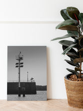 Load image into Gallery viewer, The Guardian printed on dibond aluminium, standing in a livingroom next to a house plant. Dutch surf art.
