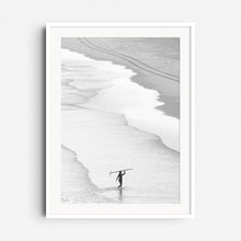 Load image into Gallery viewer, Serene surf photo with a woman carrying her longboard, framed in white wood to enhance the tranquil, minimalist vibe. Captured bij Jop Hermans
