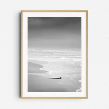 Load image into Gallery viewer, Surfboard lying in the sand on a deserted Dutch beach, framed in natural wood, capturing calm and moody surf photography from The Netherlands. Captured by Jop Hermans
