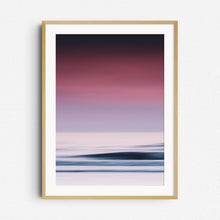 Load image into Gallery viewer, A vibrant sea photo with purple hues and bright water surfaces in The Hague. Framed in natural wood for a warm, organic touch.
