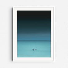 Load image into Gallery viewer, Serene turquoise photo of a surfer waiting in the North Sea. Framed surf artwork in white wood, adding a calming vibe to your space.
