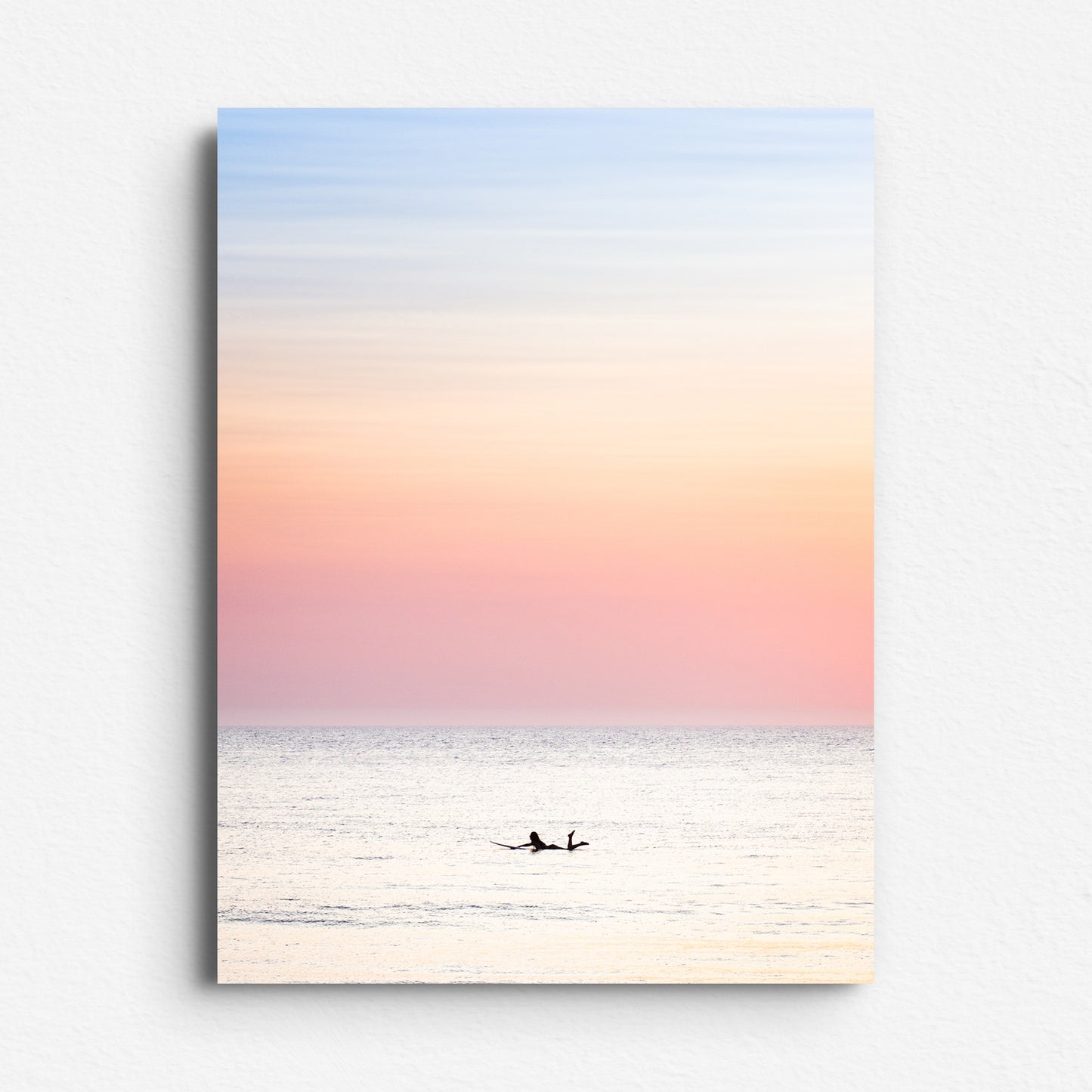 North Sea surf photo with warm pastel skies, printed on Dibond for a sleek and modern presentation of this serene moment on the The Hague coastline.