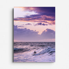 Load image into Gallery viewer, A surfer in Scheveningen beneath a purple sky and dramatic clouds. Printed on Dibond for sleek, modern wall decoration.
