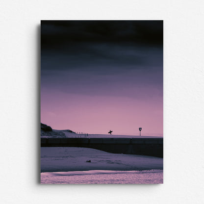 Purple sunset with a surfer walking back from the North Sea. Printed on high quality dibond. Captured by Jop Hermans