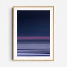 Load image into Gallery viewer, Abstract North Sea scene with purple tones, framed in natural wood. Sunset panning photo perfect for modern wall decor.
