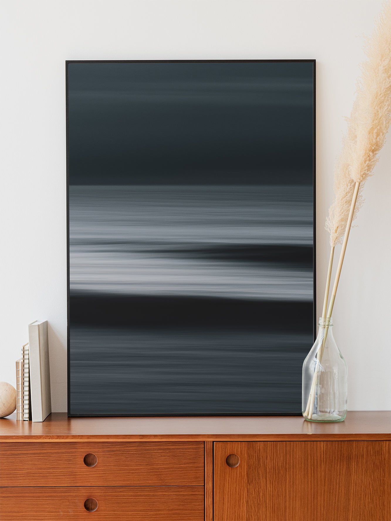 Dark abstract North Sea photo with striking contrast. Framed in black aluminum for a modern, lasting wall decor.