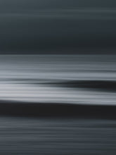 Load image into Gallery viewer, Abstract ocean view with two waves visible in a motion blur. Minimalist long-exposure photography with a dark mood.
