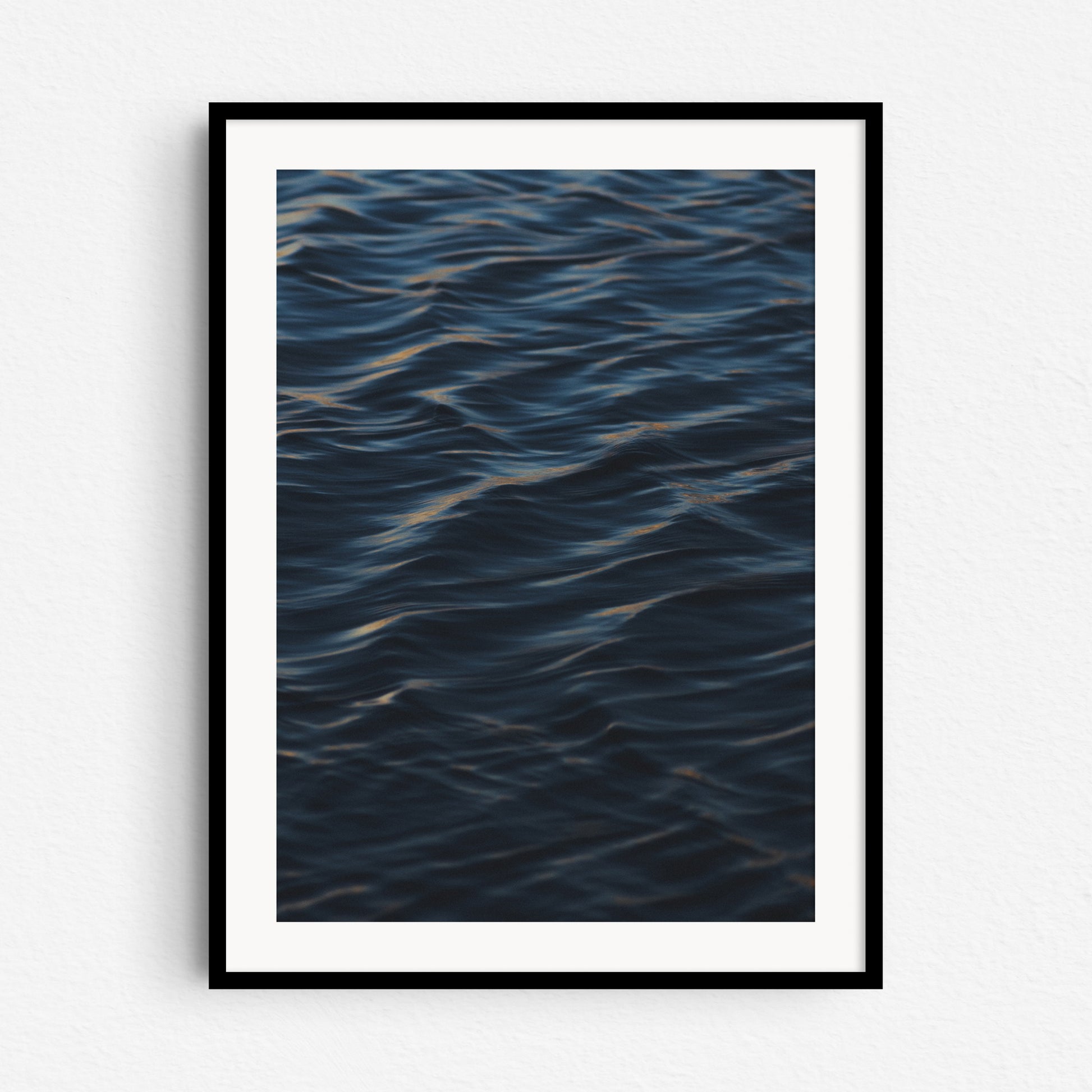 Elegant ocean art from the Netherlands, framed in black wood for easy display.