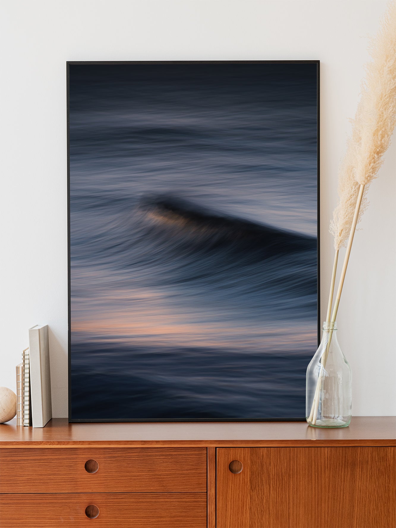 Soft purple streaks of light contrast with a dramatic wave. Poster framed in black aluminum for modern abstract artwork.