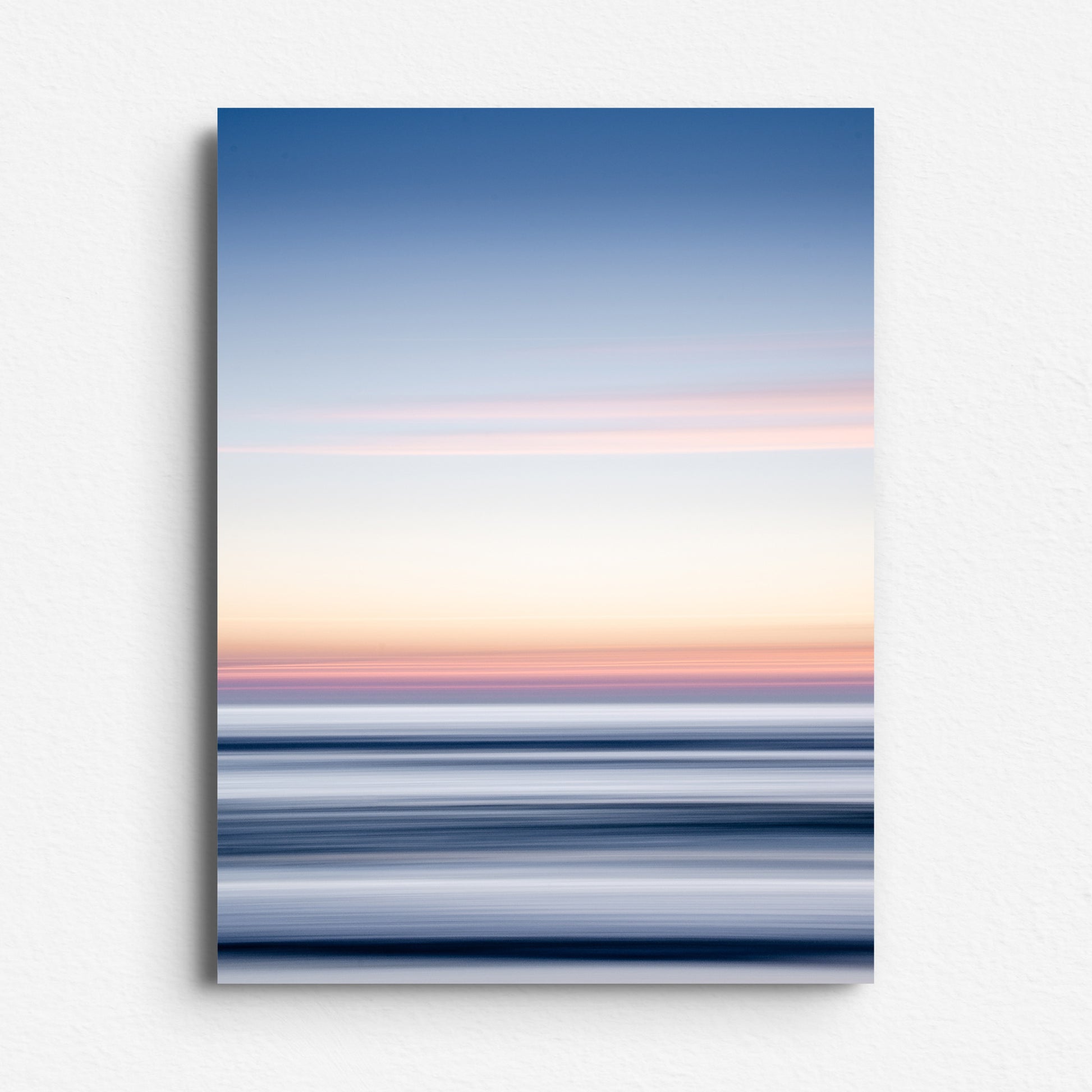 Sunset over the North Sea in blues and yellows, printed on Dibond. A modern piece with smooth transitions between light and dark.