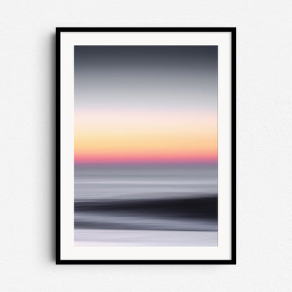 Abstract North Sea photo with contrasting shadows and orange hues, framed in black wood. A dramatic touch to modern wall decor.