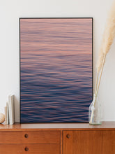 Afbeelding in Gallery-weergave laden, Pastel-colored North Sea water, captured in motion. Framed in a black aluminum frame for a sleek, modern ocean art piece.
