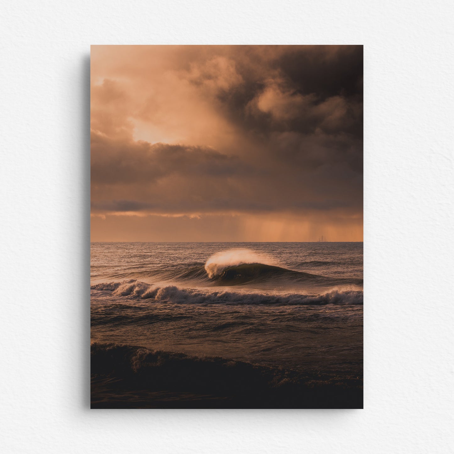 Big wave during a colourful sunset in The Netherlands, printed on dibond.