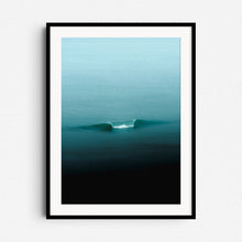 Load image into Gallery viewer, Turquoise wave on the North Sea, framed in black wood, minimalist wall art from The Hague.
