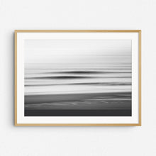 Load image into Gallery viewer, Black and white image of breaking waves captured with long exposure, framed in natural wood. Perfect for serene, nature-inspired wall art.
