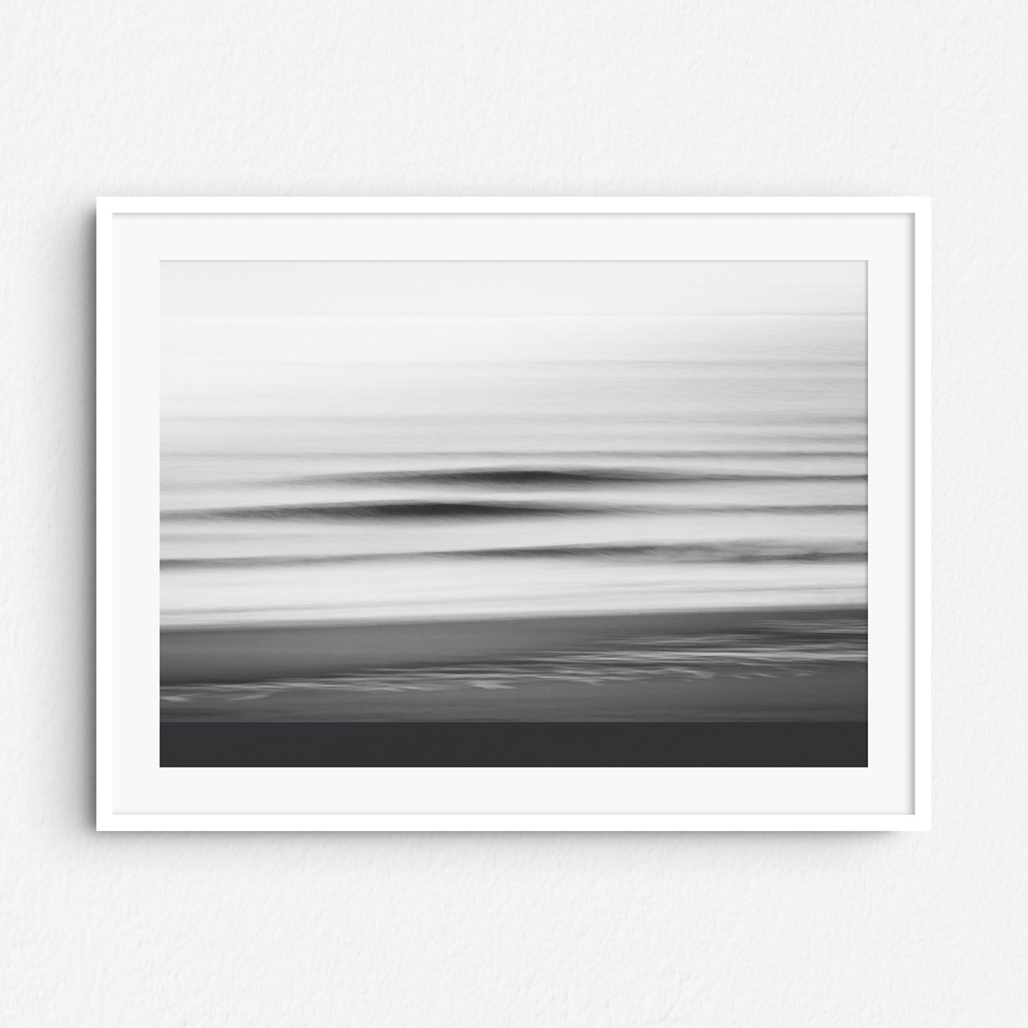 Abstract shadows of North Sea waves in black and white, framed in white wood. A striking addition to minimalist interiors.