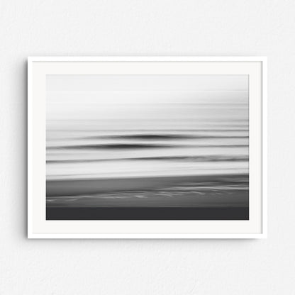 Abstract shadows of North Sea waves in black and white, framed in white wood. A striking addition to minimalist interiors.