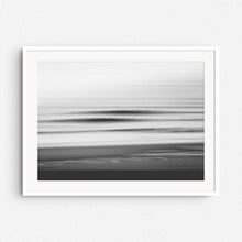 Load image into Gallery viewer, Abstract shadows of North Sea waves in black and white, framed in white wood. A striking addition to minimalist interiors.
