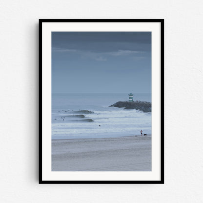 A black wooden frame with unique surf photography from the Scheveningencoast. Captured by Jop Hermans