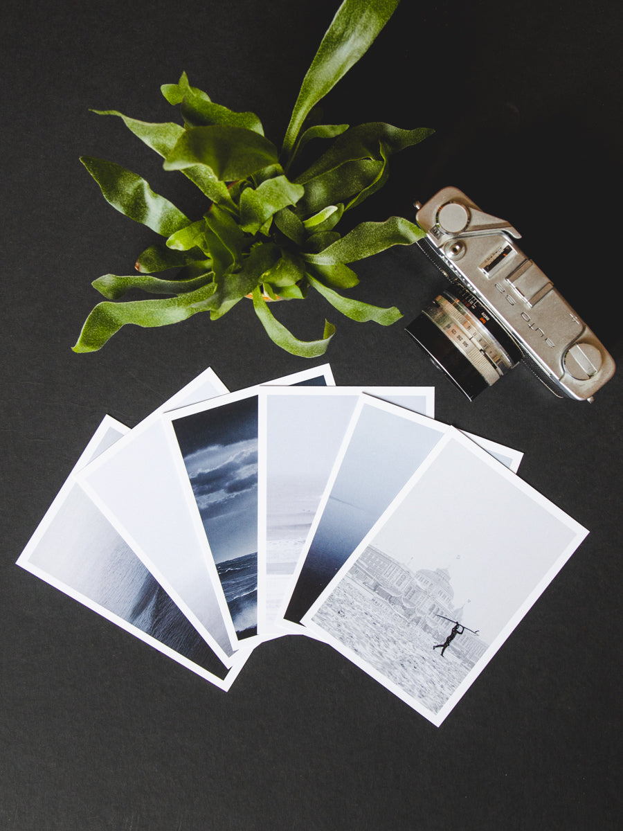 Set of six A6 postcards featuring snowy Scheveningen surf scenes, perfect for sending as a gift or framing.